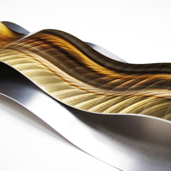 Detail view of gold wall art on white background