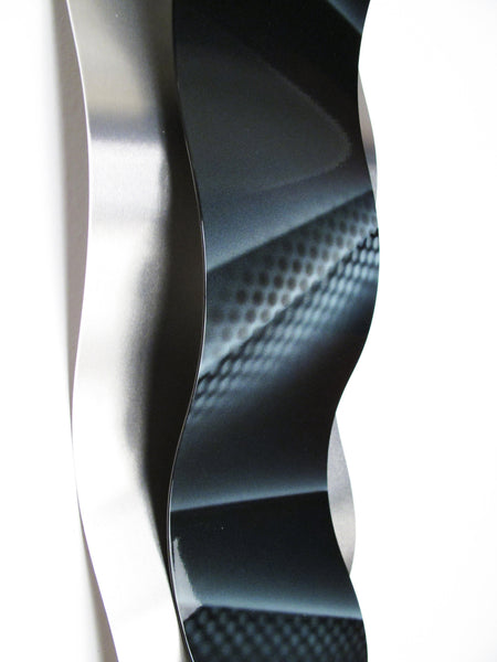 Graphic hand painted details on wall sculpture panel