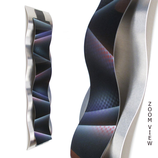 aluminum wall sculpture with purple and red graphic detail