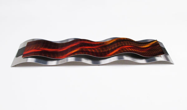 Flat view of red metal curve sculpture on white background