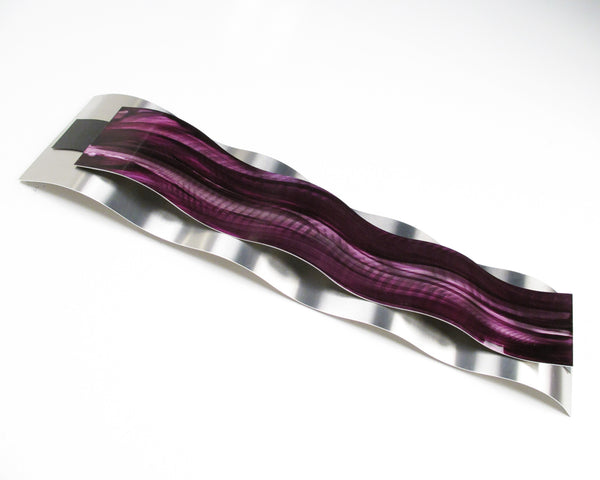 Detail view of reflective metal wall art panel