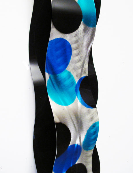 Detail of blue dots on wall sculpture