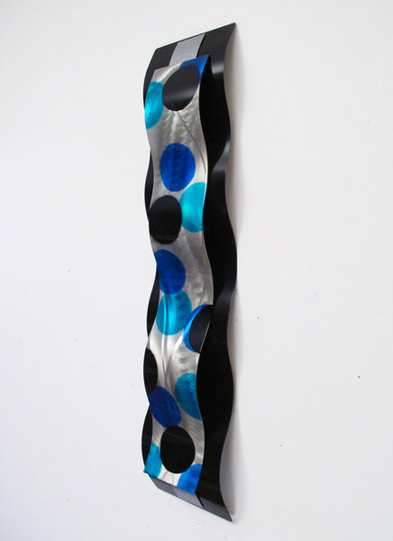 left view of wall sculpture on white background