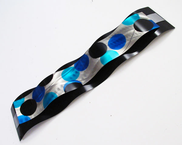 angled view of blue wall art sculpture