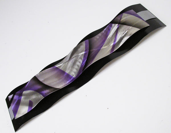 abstract wall sculpture, black with purple highlights