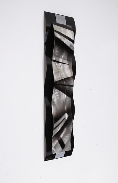 black and silver metal wall sculpture