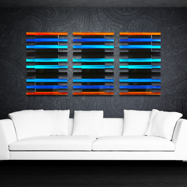 Blue and Orange Large metal wall sculpture above white sofa